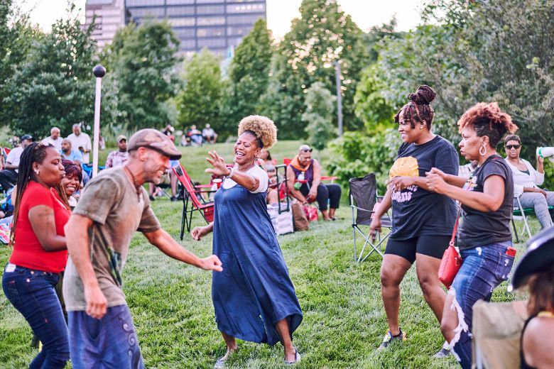 People dance at Blues at the Arch during summer in St Louis.