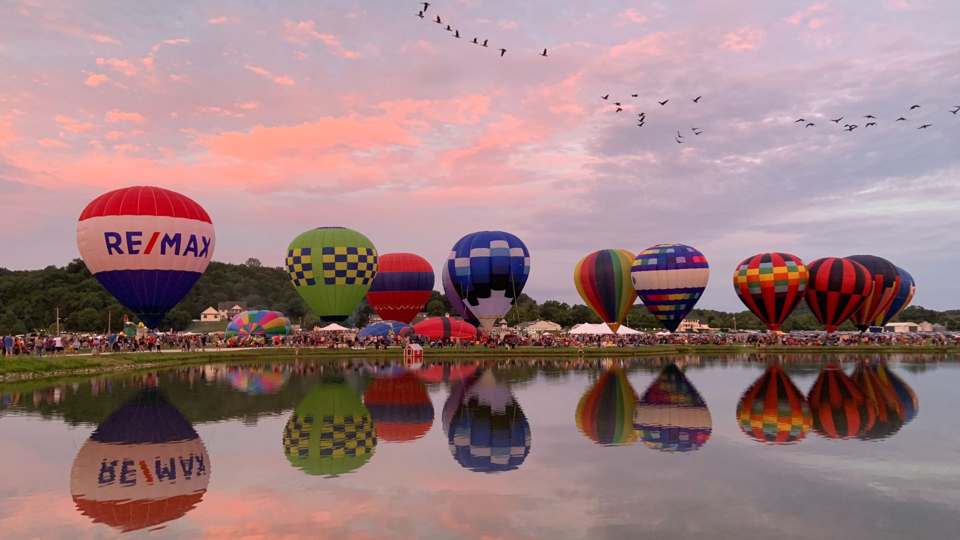As the sun sets, hot air balloons light up the night at Brookdale Farms.